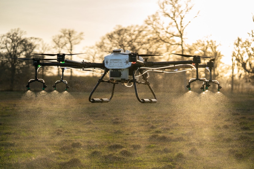 Hylio's agricultural drone for farmers sprays over a field.