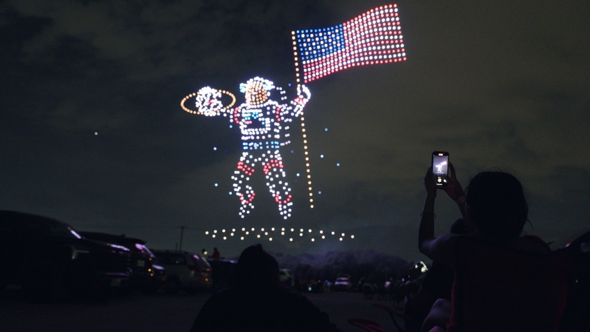 Sky Elements Drone Show's space man with flag made out of drones.