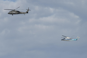 NASA pilots along with Sikorsky safety pilots flying Sikorsky’s Black Hawk Optionally Piloted Vehicle, left, and SARA S-76B
