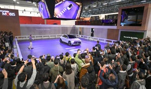 The audience reacts to the debut of the crab-walking MOBION, from leading automotive parts supplier Hyundai Mobis.