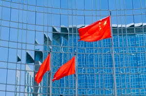 Chinese flags flying outside a building