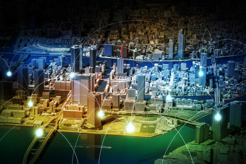 Image shows a smart city diorama and wireless sensor network.