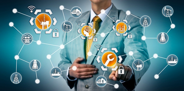 Image shows a corporate executive initializing AI aided predictive maintenance of an offshore platform via industrial interne Image shows a corporate executive initializing AI aided predictive maintenance of an offshore platform via industrial interne