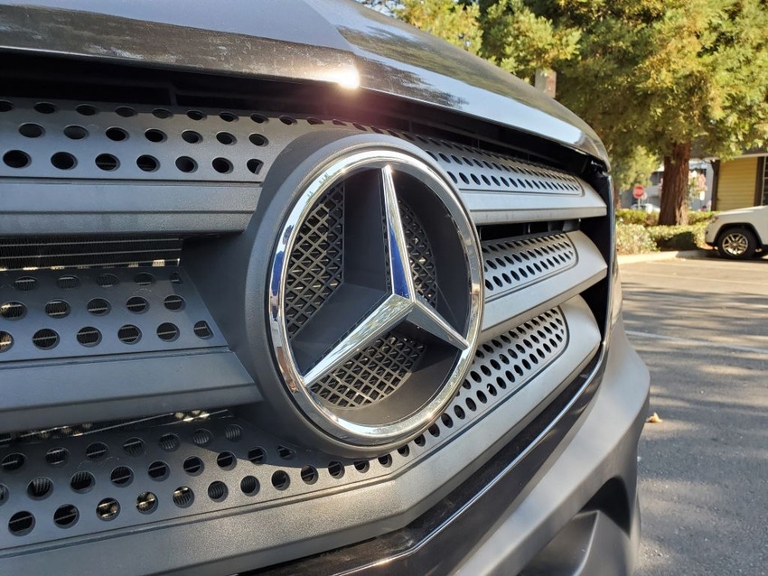 Image shows the front of a Mercedes Benz vehicle with emblem