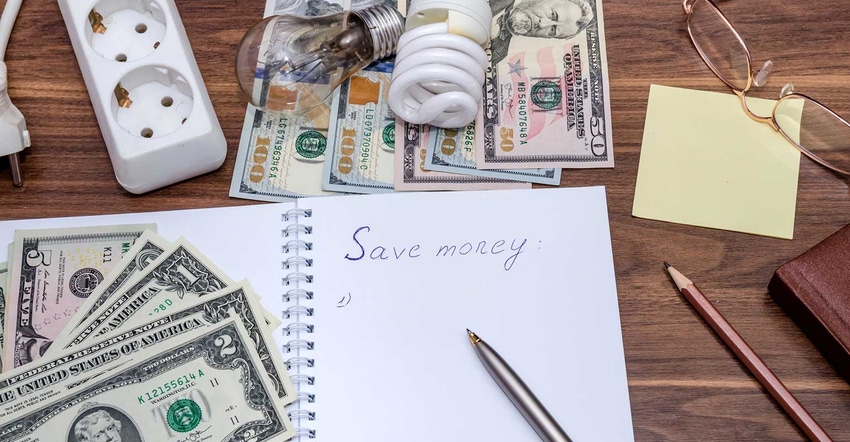 Desk with cash and lightbulbs