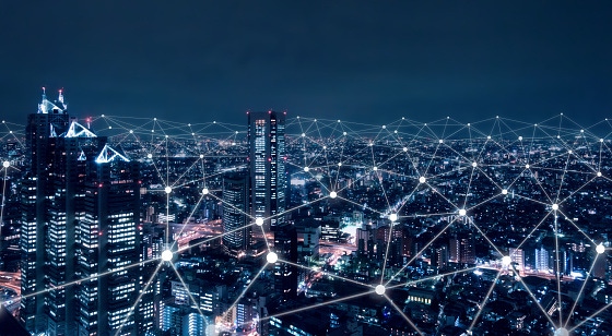 Image shows a telecommunication network above city, wireless mobile internet technology for smart grid or 5G LTE data connect