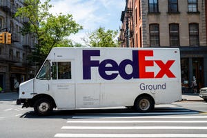 Image shows a FedEx Delivery Truck