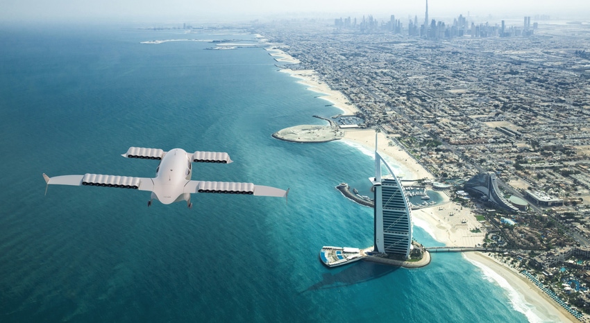 Lilium's electric jet flying over water with a city in the distance.