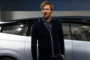 Speaker stood infront of car Speaker stood infront of car