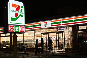 Exterior of a 7-Eleven convenience store at night in Tokyo
