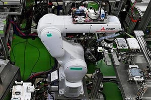 Image shows a Mitsubishi Electric robot in action.