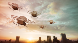 Image shows drones flying over a city.