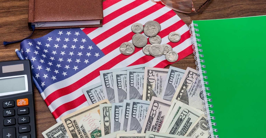 US flag on desk with money
