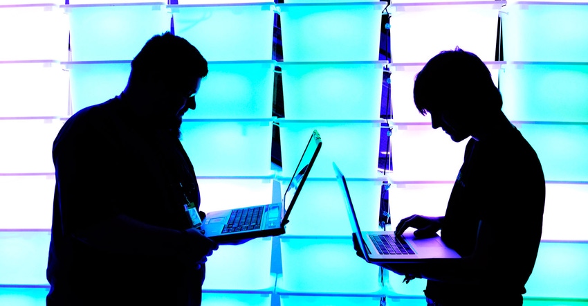 Silhouette of two laptop users Silhouette of two laptop users