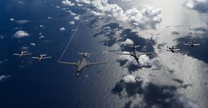 Six USAF aircraft flying information over the ocean