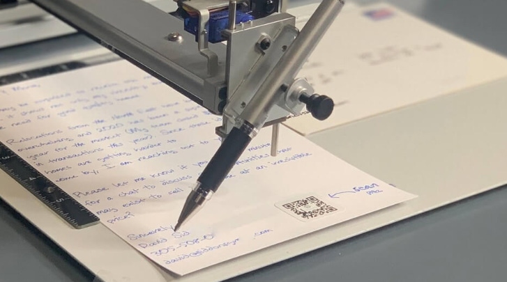 Image shows Audience's handwriting robot at work