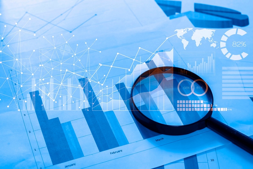Image of magnifying glass against chart background Image of magnifying glass against chart background