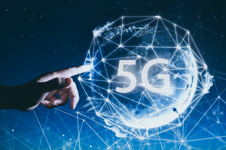 Image shows 5G network wireless systems and internet of things with man touching Abstract 5G letters
