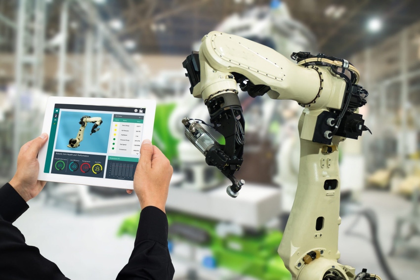 Image shows industrial engineer using software in tablet to monitor a machine in real time. Image shows industrial engineer using software in tablet to monitor a machine in real time.