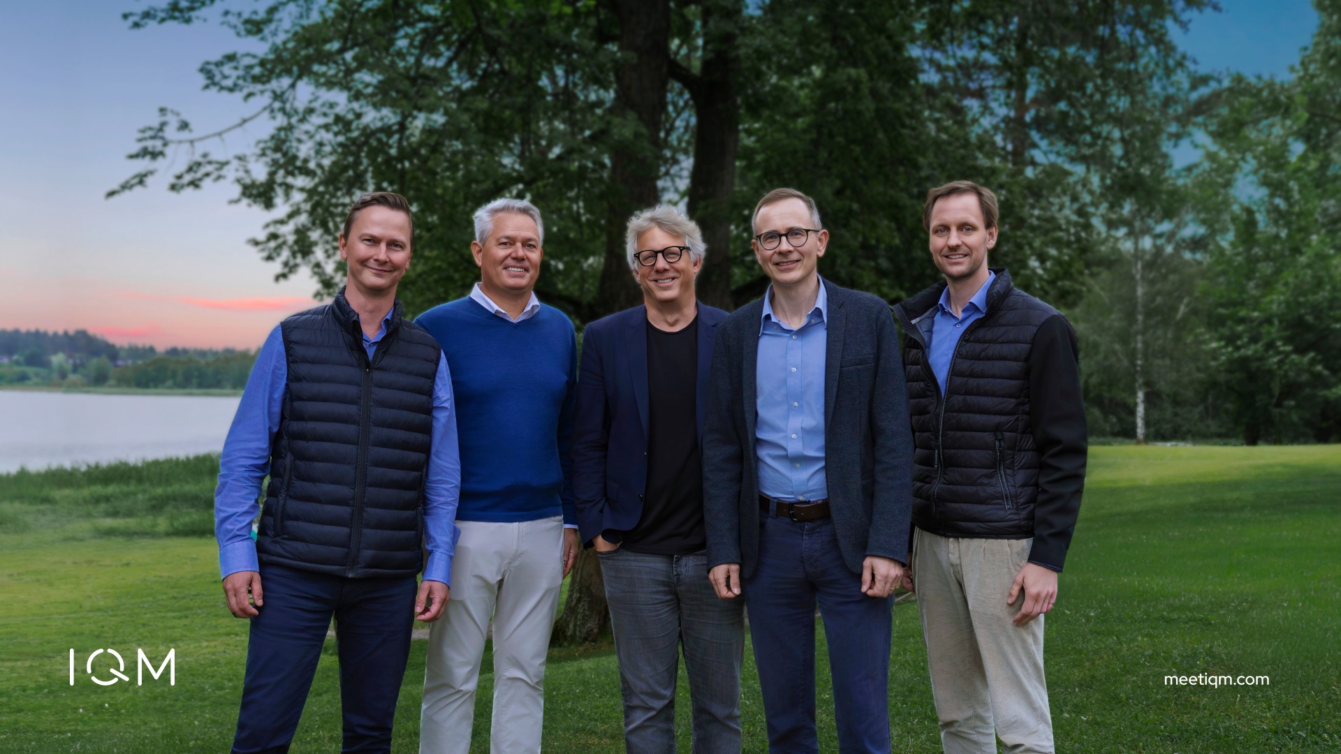 Group photo of investors and IQM executives