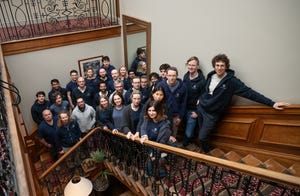 The Phasecraft team standing on a staircase looking up at the camera The Phasecraft team standing on a staircase looking up at the camera