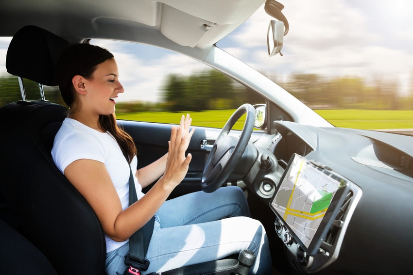 Image shows a woman sitting in a self-driving car. Image shows a woman sitting in a self-driving car.