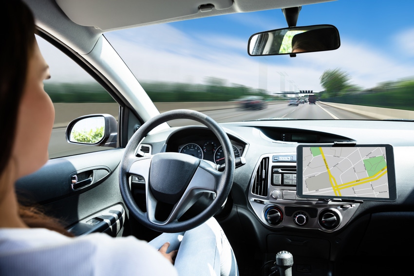 A close up of a female passenger in a self-driving car