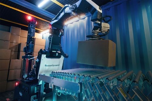 Images shows a Boston Dynamics Stretch robot in action. Images shows a Boston Dynamics Stretch robot in action.