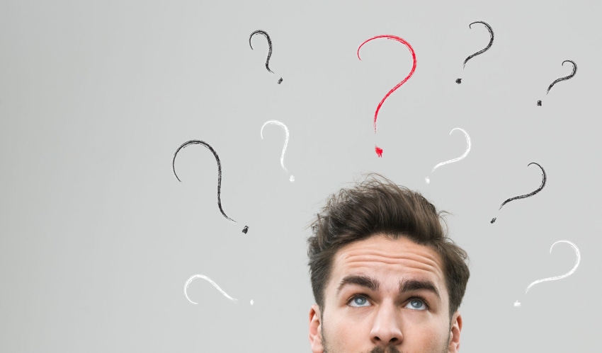 Man thinking with questions marks above his head Man thinking with questions marks above his head