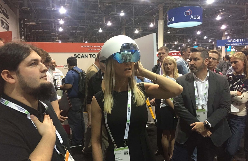 Penton regional sales account manager Emily Capaccioli tries out the DAQRI smart helmet at Autodesk University in November. Penton regional sales account manager Emily Capaccioli tries out the DAQRI smart helmet at Autodesk University in November.