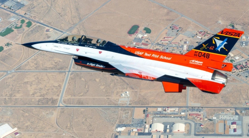 An orange, black and white fighter jet takes to the skies