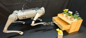 A still of a robot dog opening a drawer with a gripper-like hand
