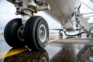Picture of airplane landing gear on the runway