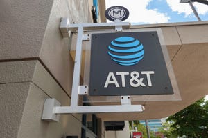 An AT&T sign hangs outside of a store on April 01, 2024, in Miami, Florida