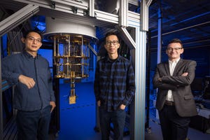 The Diraq research team in front of a quantum computer "chandelier"