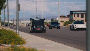 A Zoox self-driving taxi (robotaxi) travels on a road in Las Vegas. Zoox is owned by Amazon.