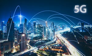 Image shows 5G network wireless systems and internet of things with modern city skyline.