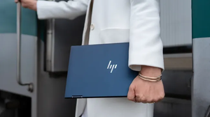 A business woman holding a laptop