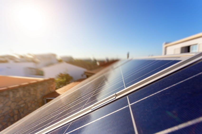 Image shows solar energy storage panels on the roof of a house Image shows solar energy storage panels on the roof of a house