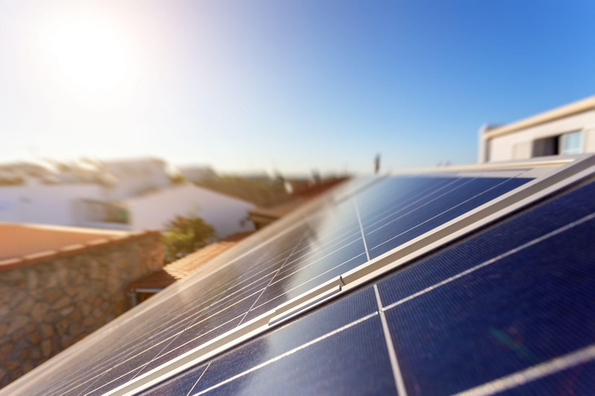 Image shows solar energy storage panels on the roof of a house