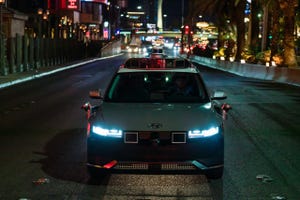 Image shows a Motional robotaxi at night in Las Vegas
