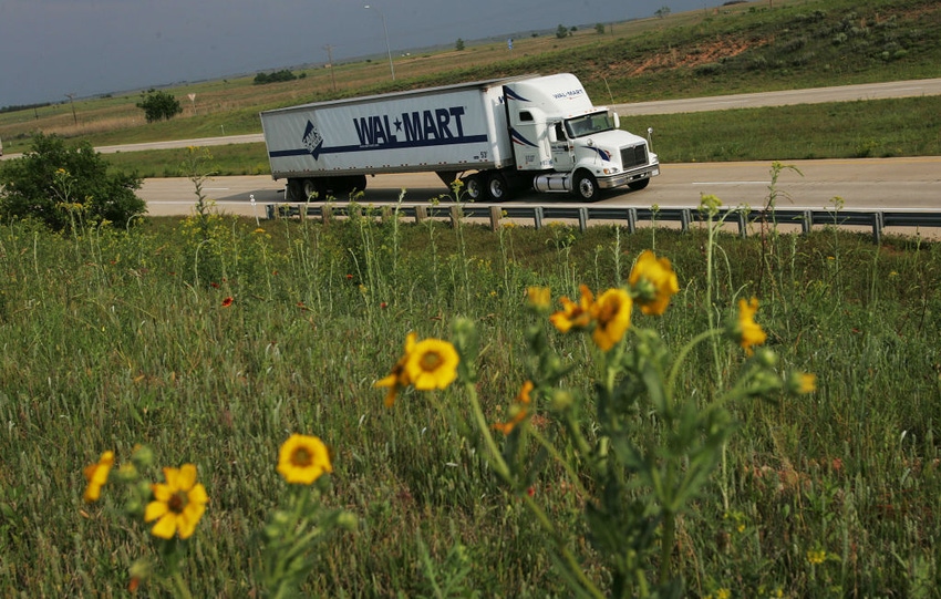 Image shows a Walmart truck driving down the highway.
