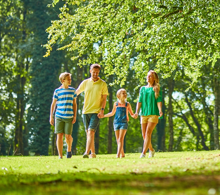 Couple walking dog caravan park