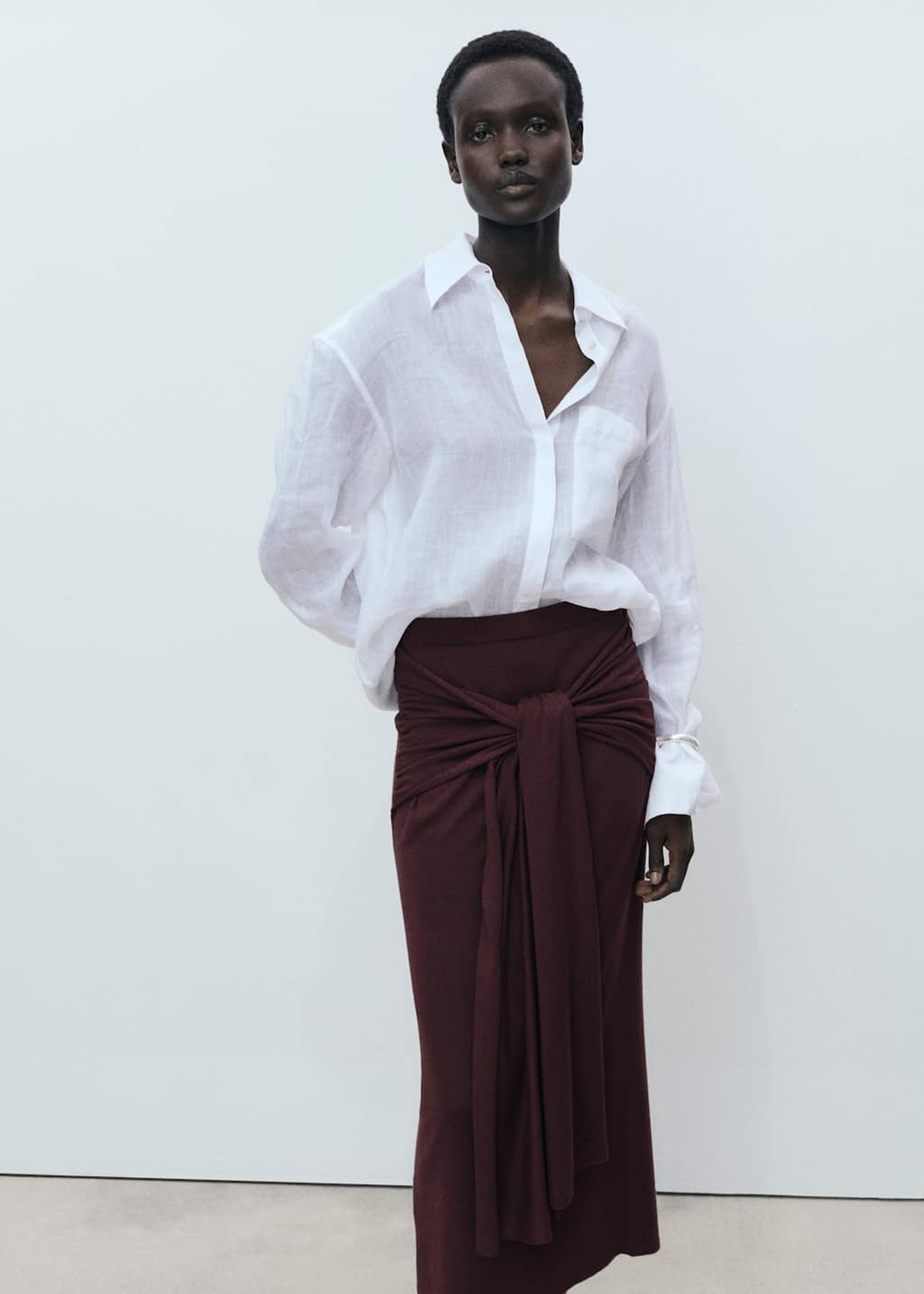 Outfit for summer travel with denim shorts and a white t-shirt.