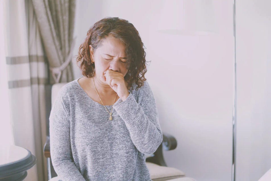 a woman coughing