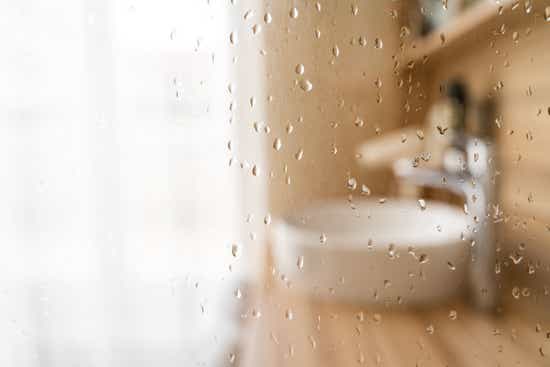 Shower glass with water droplets 