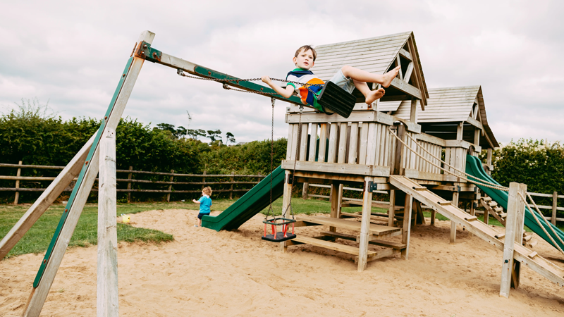 Children at the play park at Pentire Holiday Park in Bude, Cornwall