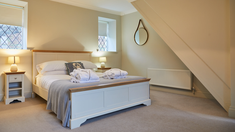 The master bedroom in the lakeside cottage at Brynteg Holiday Park in North Wales