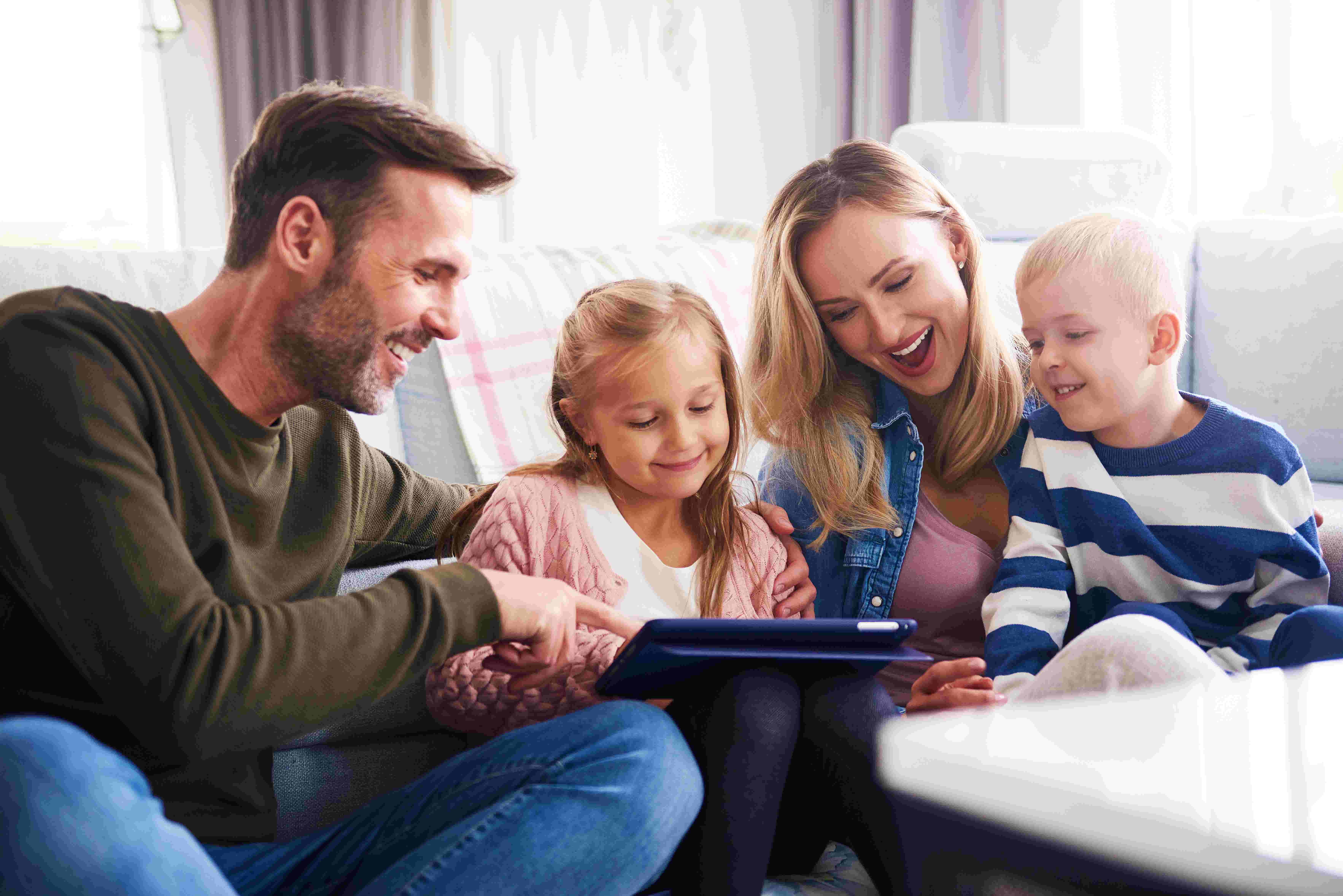 A family looking at a tablet