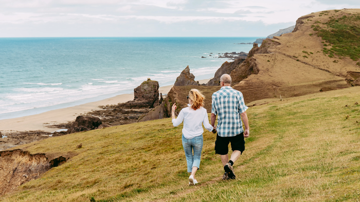 A coupld walking along the cliffs at Sandymouth Beach, close to Pentire Coastal Holiday Park